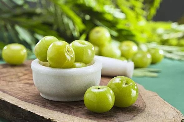 How to Use Amla for Thicker, Fuller Hair (and Darken Greys)
